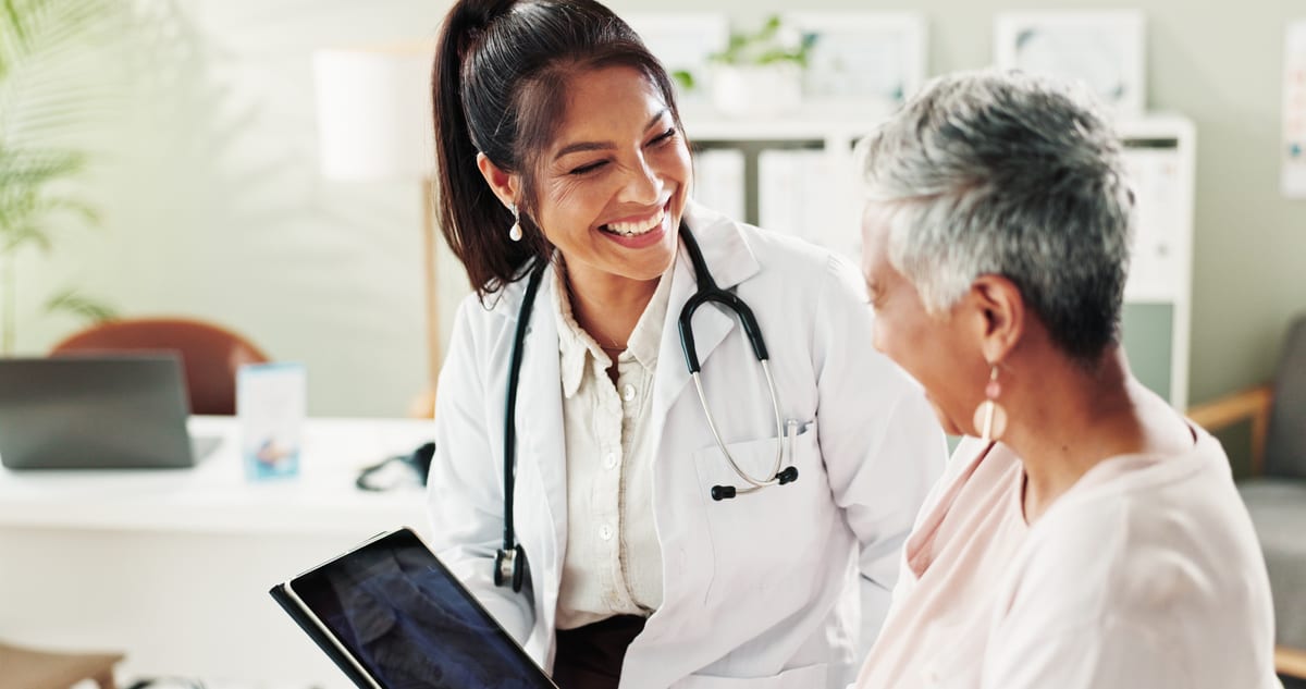 A doctor talking with a patient during a visit